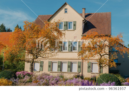 House with nice garden in fall. Flowers in the City Park of Bietigheim-Bissingen, Baden-Wuerttemberg, Germany, Europe. Autumn Park and house, nobody, bush and grenery House with nice garden in fall. Flowers in the City Park of Bietigheim-Bissingen, Baden-Wuerttemberg, Germany, Europe. Autumn Park and house, nobody, bush and grenery 96361937