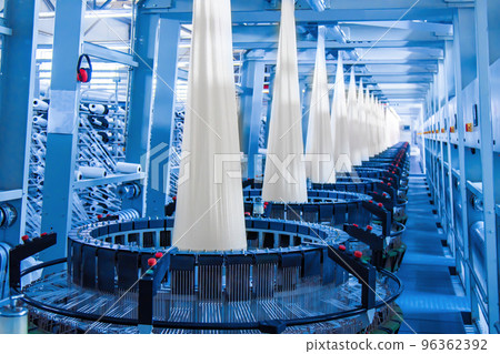 Production of white polypropylene flat yarn for the production of industrial bags. Allison-circular loom woven bag machine. Production of polypropylene sleeves. Shuttle. 96362392