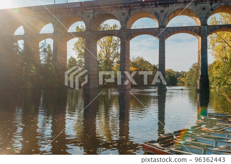 Railway Bridge with river in Bietigheim-Bissingen, Germany. Autumn. Railway viaduct over the Enz River, built in 1853 by Karl von Etzel on a sunny summer day. Bietigheim-Bissingen, Germany. Old Railway Bridge with river in Bietigheim-Bissingen, Germany. Autumn. Railway viaduct over the Enz River, built in 1853 by Karl von Etzel on a sunny summer day. Bietigheim-Bissingen, Germany. Old 96362443