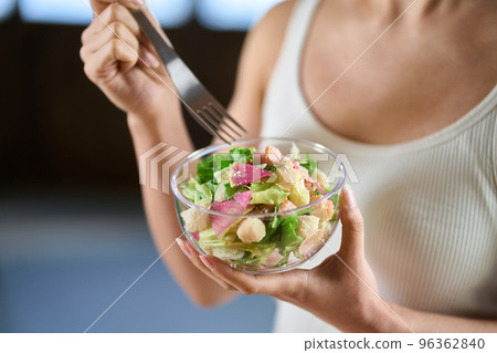 Asian woman eating salad for diet 96362840
