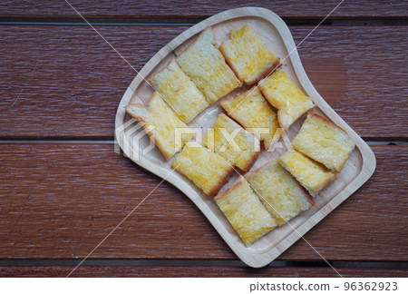 top view milk toast with sugar on wooden dish on a wooden table background, food, dessert, health, copy space 96362923