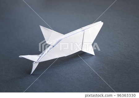 White paper shark origami isolated on a grey background 96363330