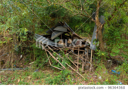 Ruined abandoned hut in the jungle close up Ruined abandoned hut in the jungle close up 96364368