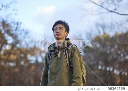 Young Japanese man enjoying climbing 96364569