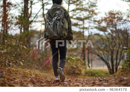 Young Japanese man enjoying climbing Young Japanese man enjoying climbing 96364578
