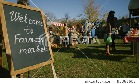 People shopping on urban farmers market People shopping on urban farmers market 96365693