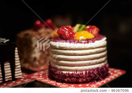 delicious beautiful colorful little cake with strawberries and fruits delicious beautiful colorful little cake with strawberries and fruits 96367096