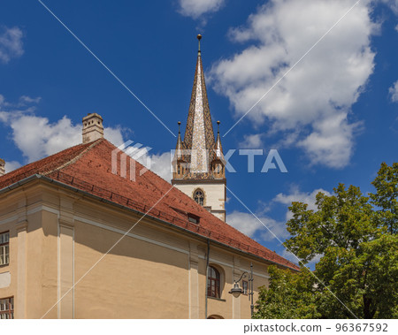 Building of Lutheran Cathedral of Saint Mary (Biserica Evanghelica) dominated by seven level tower 96367592