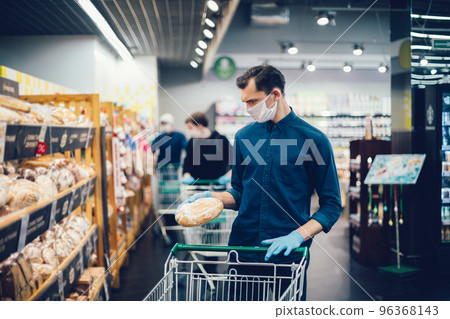 close up. young man buying bread in a supermarket. close up. young man buying bread in a supermarket. 96368143