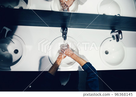 close up. man carefully washes his hands with soap 96368145