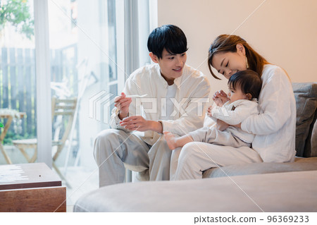 Baby eating baby food 96369233