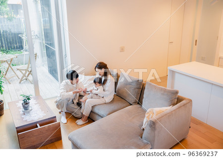 Baby eating baby food 96369237