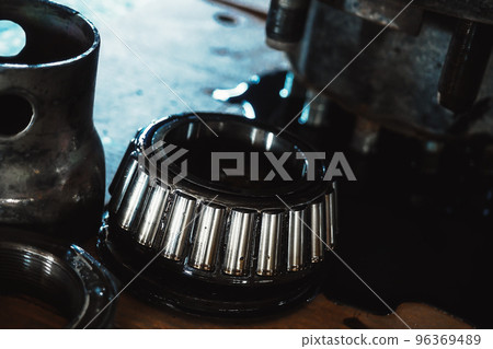 Lubricated roller bearing. Truck suspension repair part. Close-up. Background. 96369489