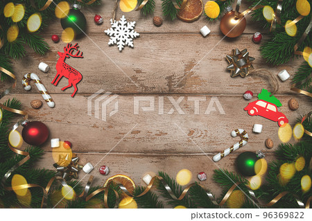 Fir tree branches with Christmas decoration on wooden background, flat lay Fir tree branches with Christmas decoration on wooden background, flat lay 96369822
