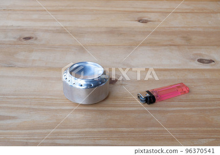 Alcohol stove home made for camping on table. 96370541