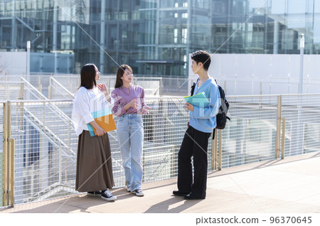 Three male and female college students chatting 96370645
