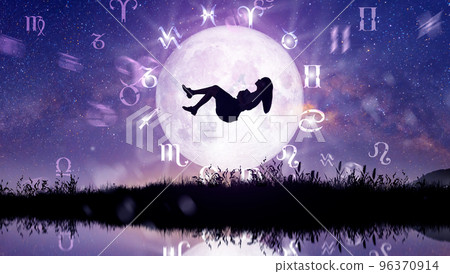 Astrological zodiac signs inside of horoscope circle. Woman levitating over the stars and moon over the zodiac wheel and milky way background. The power of the universe concept. Astrological zodiac signs inside of horoscope circle. Woman levitating over the stars and moon over the zodiac wheel and milky way background. The power of the universe concept. 96370914