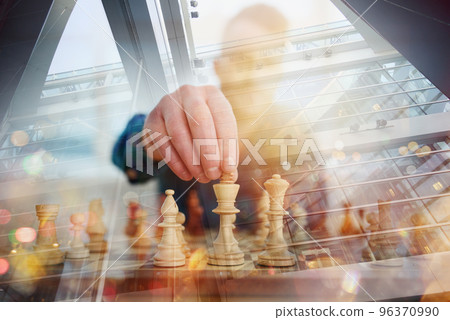 Businessmen play chess as strategy and tactic concept Businessmen play chess as strategy and tactic concept 96370990