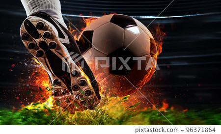 Powerful kick of a soccer player with fiery ball 96371864