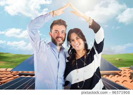 Family uses renewable energy system with solar panel 96371908