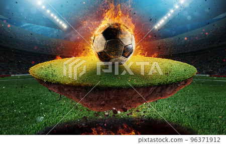 Fiery soccer ball exits from a football stadium 96371912