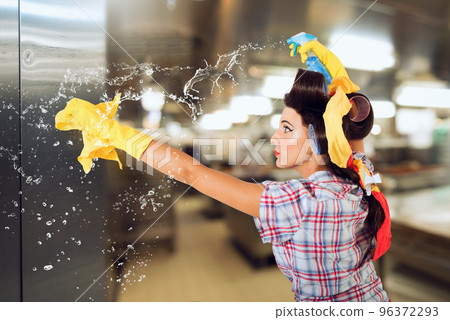 Funny housewife cleans and disinfects to keep germs away Funny housewife cleans and disinfects to keep germs away 96372293