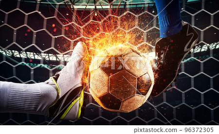 Close up of a football action scene with competing soccer players at the stadium 96372305