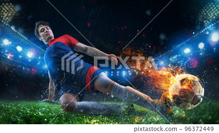 Powerful kick of a soccer player with fiery ball 96372449