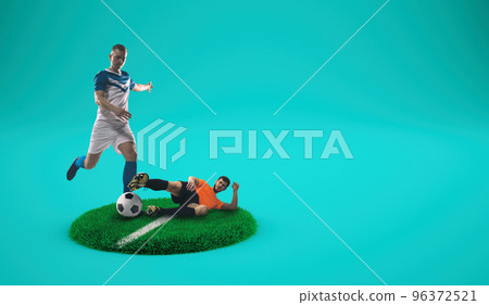 Soccer players compete for the ball on a grassy plate with cyan background 96372521