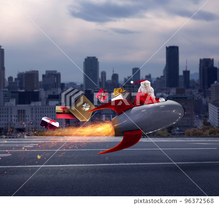 Santa claus delivers gifts with a fast space rocket Santa claus delivers gifts with a fast space rocket 96372568