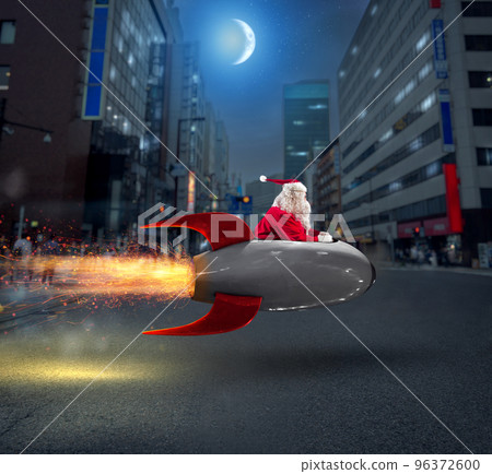 Santa claus delivers gifts with a fast space rocket 96372600