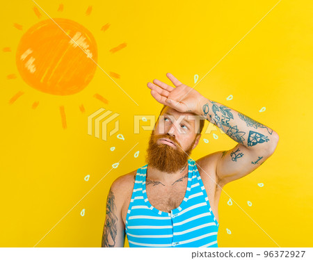 Man in swimsuit sweats due to too hot 96372927