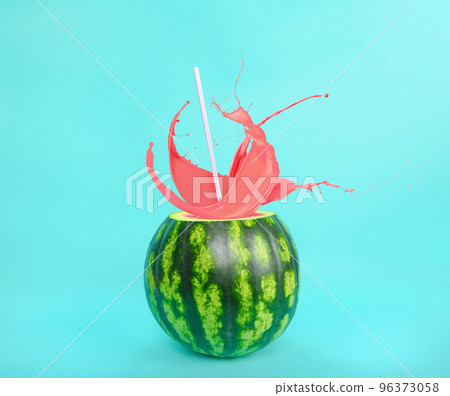 Fresh juice splash exits from a watermelon 96373058