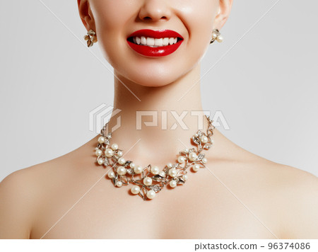 Beauty smiles . Red lipstick and jewelry . Beauty 96374086