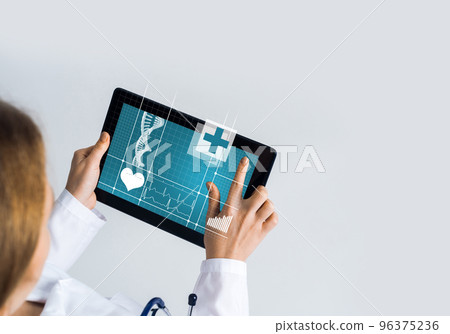 Close of female doctor hands working with tablet pc computer Close of female doctor hands working with tablet pc computer 96375236