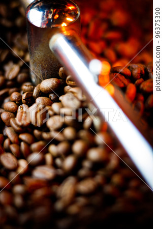 Coffee beans in a coffee machine, in dark colors. Coffee beans in a coffee machine, in dark colors. 96375390