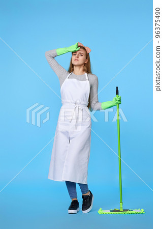 woman in rubber gloves and cleaner apron washing floor with mop woman in rubber gloves and cleaner apron washing floor with mop 96375490