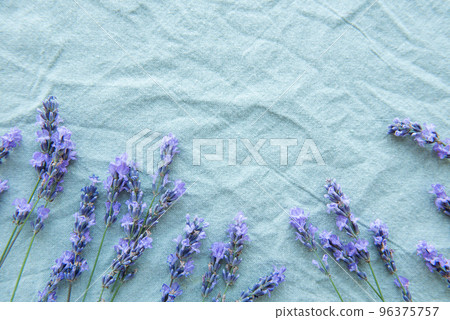 Lavender flowers and leaves creative frame on a textile background 96375757