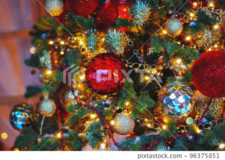 Closeup Christmas tree decoration baubles. Abstract festive glitter texture and background. Holiday greeting card 96375851