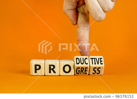 Word progress and productive symbol. Businessman turns cubes and changes the concept word Productive to Progress. Beautiful orange background. Business progress and productive concept. Copy space. 96376152