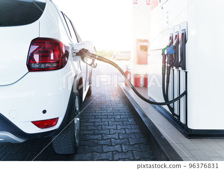 Fuel pump fill a tank of a car in a station 96376831