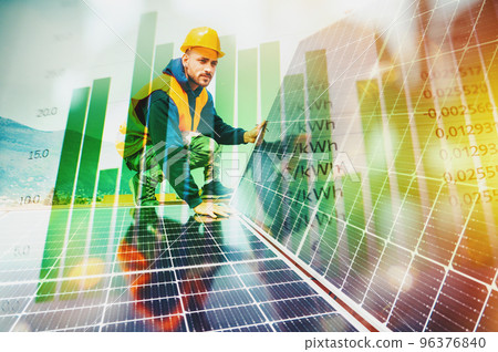 Workers assemble energy system with solar panel for electricity Workers assemble energy system with solar panel for electricity 96376840