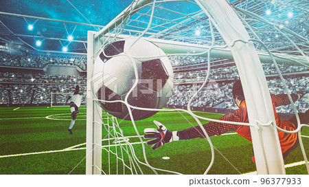 Goalkeeper in orange uniform catches the ball in the stadium during a football game 96377933