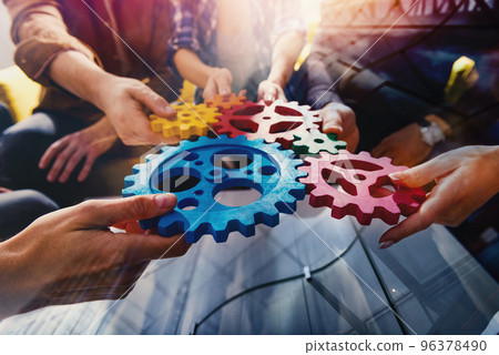 Business team connect pieces of gears like a teamwork and partners Business team connect pieces of gears like a teamwork and partners 96378490