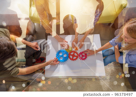 Business team connect pieces of gears like a teamwork and partners Business team connect pieces of gears like a teamwork and partners 96378497
