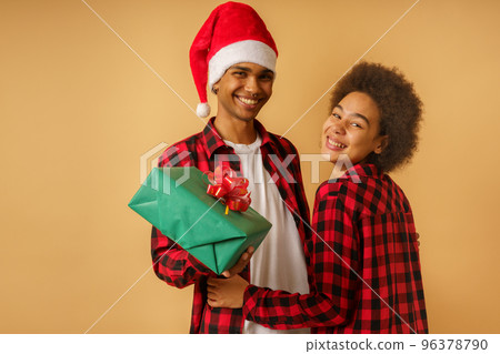 Happy man has received a christmas gift from his girlfriend 96378790