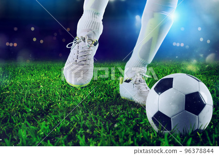 Soccer player ready to kick the soccerball at the stadium 96378844