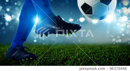 Soccer player ready to kicks the ball at the stadium 96378846