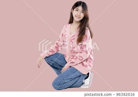 Portrait of Happy Asian ethnicity teen girl isolated on pastel pink background. Portrait of Happy Asian ethnicity teen girl isolated on pastel pink background. 96382016