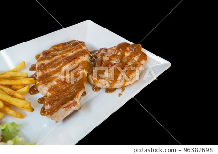 Top view of pork steak with french fried and Kraft in white plate, focus selective Top view of pork steak with french fried and Kraft in white plate, focus selective 96382698